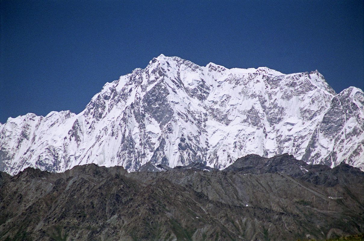 06 Nanga Parbat Rupal Face From The Deosai Plains The Mazeno Ridge leads to the enormous Rupal Face of Nanga Parbat, seen from the Deosai Plains. From the summit, the ridge leads down then ridge, past the North Peaks to the Southeast Peak and East Peaks and then plummets to Rakhiot Peak.